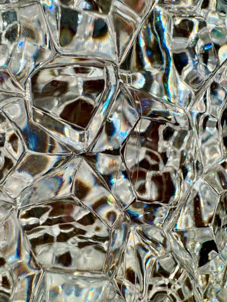 istock Close up of textured glass with light coming through and causing rainbow and shadow pattern 2191903753