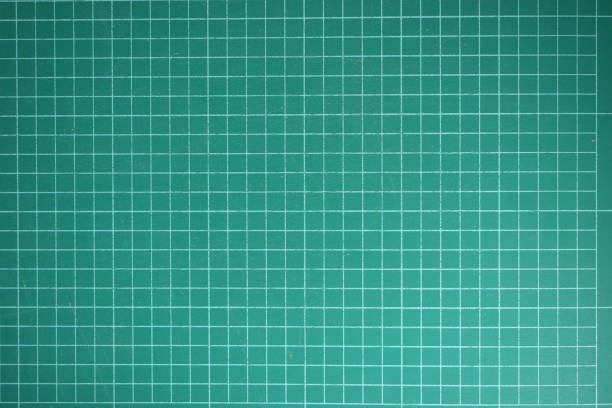 istock green cutting mat board background with line and scale measure guide pattern for object art design, tool equipment of diy craft work 2191904600