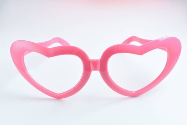 pink heart shape of glasses on white background