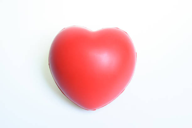 istock single red stress ball isolated on white background, heart shape toy 2191905083