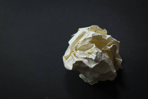round lump paper on black background, recycle used paper