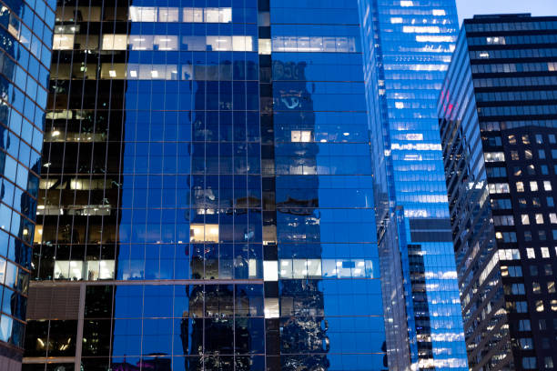 istock Building architecture at night. Building background. Glass building window. Architectural detail. Background of architecture. Modern glass background. Glass background. Modern backdrop. Architecture 2191906747