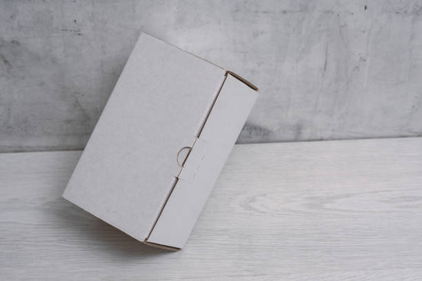 Eco friendly packaging sustainable shipping box on light background. Simple and sturdy packaging for product protection