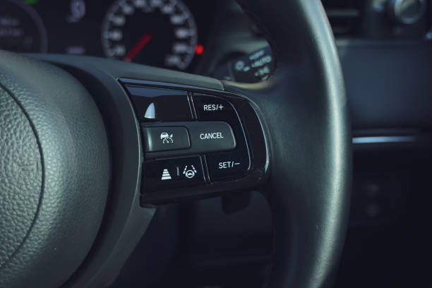 istock interior view of car with black leather, steering wheel with button 2191908740