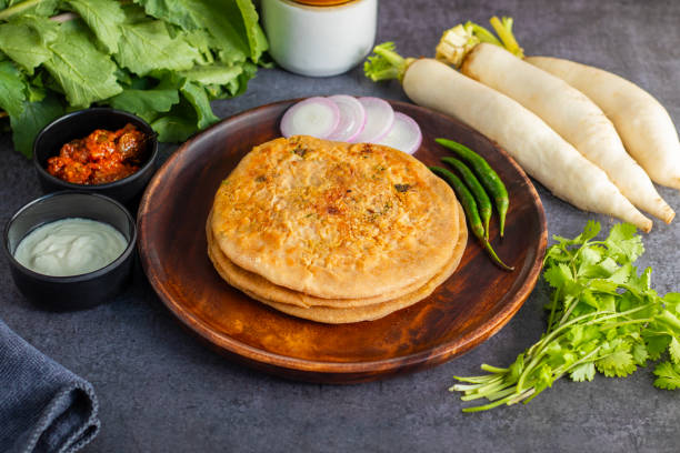istock Mooli paratha is a stuffed Indian flatbread made with grated radish, whole wheat flour, and spices, offering a flavorful, nutritious, and wholesome meal. 2191910584