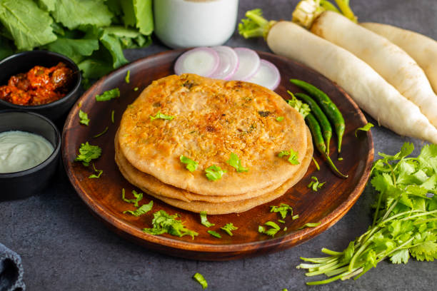 istock Mooli paratha is a stuffed Indian flatbread made with grated radish, whole wheat flour, and spices, offering a flavorful, nutritious, and wholesome meal. 2191910592