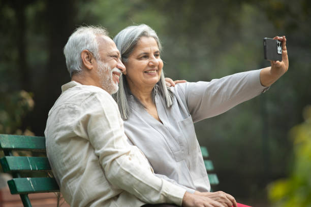 istock Senior couple taking selfie over mobile phone in park 2191913706