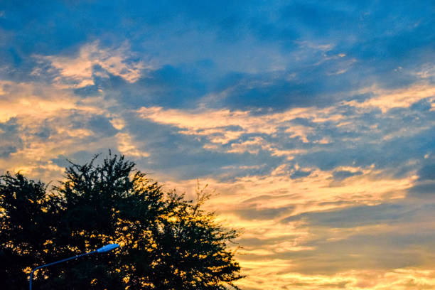 The scene captures the fleeting moment between day and night, evoking nostalgia.