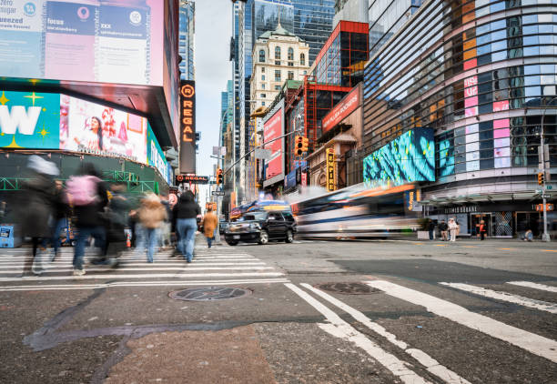 istock motion blurred people crosssing avenue in manhattan 2191918584