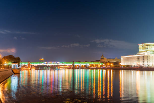 Pushkinskiy bridge with night illumination. Pedestrian bridge with night illumination. Bridge to Gorky Park. Embankment of the Moscow River