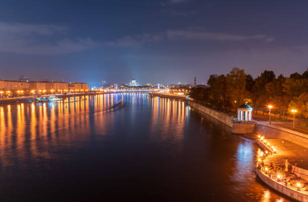 Krymsky Bridge or Crimean Bridge in Moscow at summer night. Steel suspension bridge in Moscow over the Moskva River