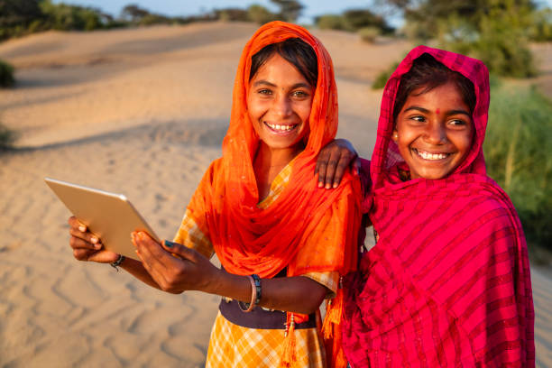 istock Happy Gypsy Indian girls using a digital tablet, India 2191924820