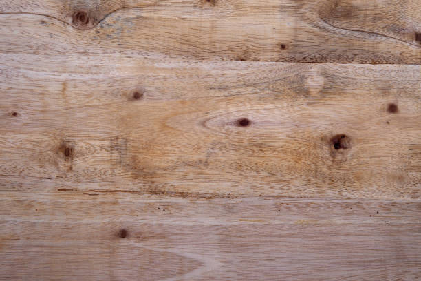 istock Light brown wood planks with a natural grain pattern are suitable for backdrops, textured layers, rustic designs and woodworking themes 2191925226