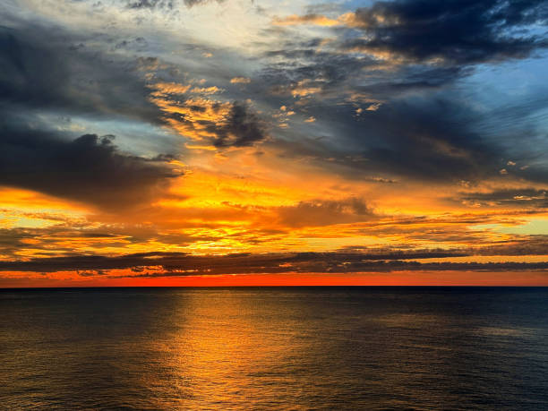 istock Incredible sunset sky and calm sea at evening. 2191929602