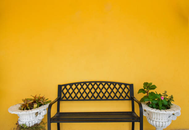 istock A resting chair against a yellow background warmth and comfort in a single frame. 2191929636