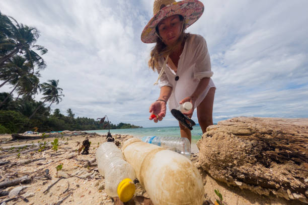 istock Woman Collecting Plastic Waste on Beach 2191932767