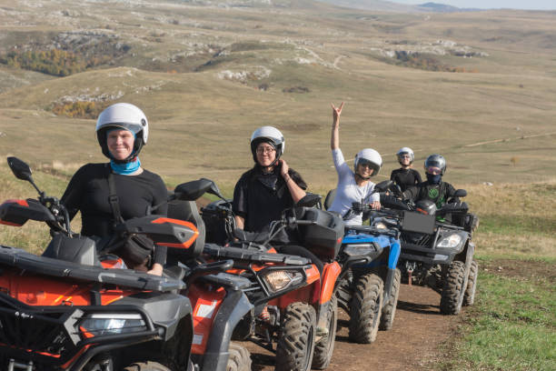 istock A group of five young people on ATVs riding along a mountain road 2191933961