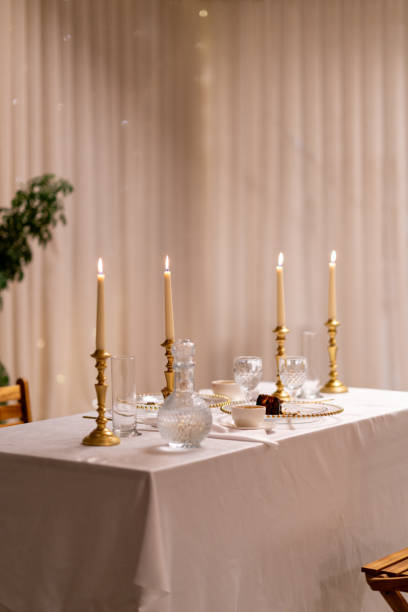 Elegant table setting with burning candles creating a romantic ambiance