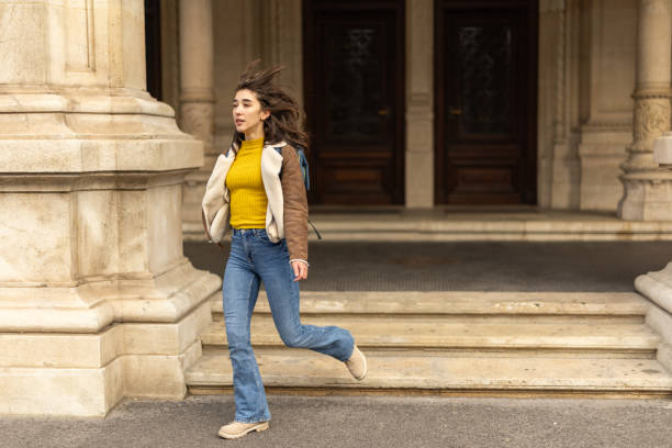 istock Young female student leaving college building 2191939024