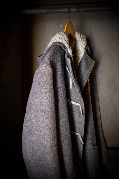 istock Vintage Duffle Coat Hung Up In A Wardrobe 2191943852