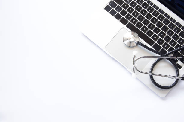 istock Laptop and stethoscope on white background, top view 2191947289