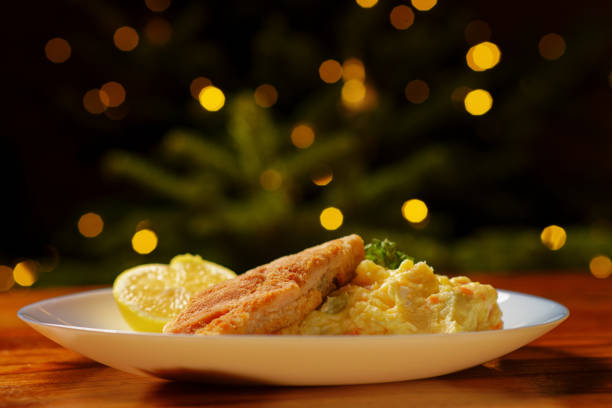 Traditional Czech Christmas food fried breaded carp fish with potato salad