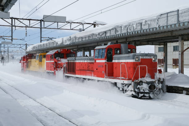 Iwamizawa-city, Hokkaido, Japan - December 29, 2024 : DE10 and DE15 Russel train running through the Iwamizawa station