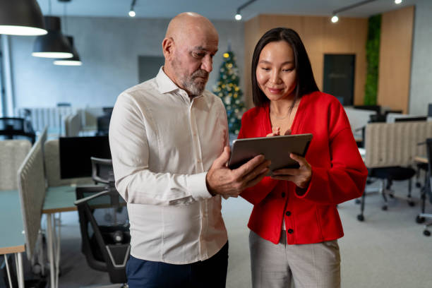 istock Colleague having discussion at office 2191954173