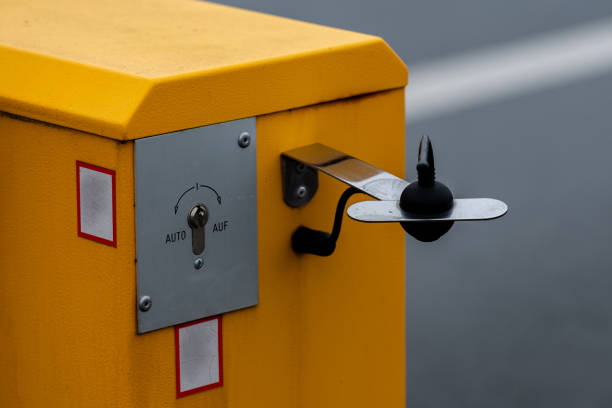 istock Yellow barrier control device for access management in a parking area 2191954237