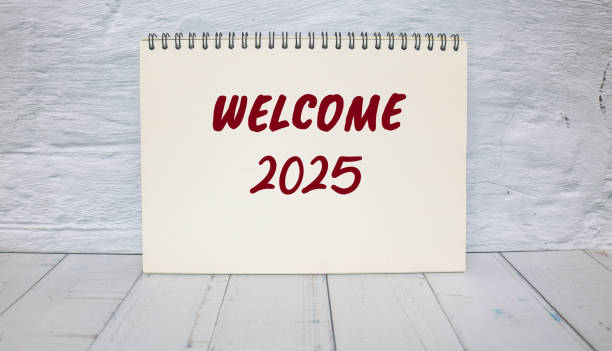 istock Welcome to 2025 message written on notebook with wall background. Conceptual welcome to 2025 symbol. Copy space. 2191954427