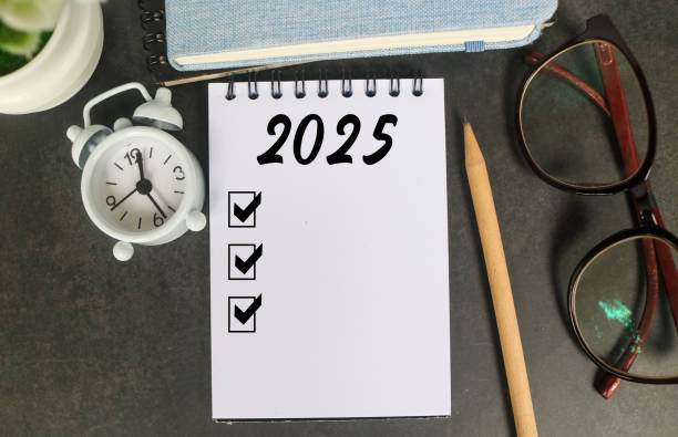 istock 2025 New Year resolutions goals, plans, and resolutions concept. Planning checklist 2025 target on notebook with office desk background 2191954431