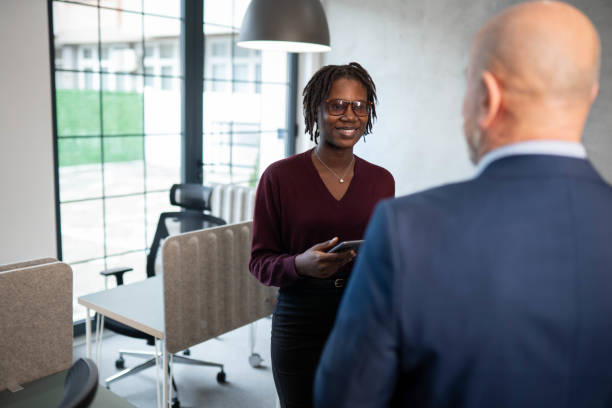 istock Two business person discussing inside modern office 2191955514