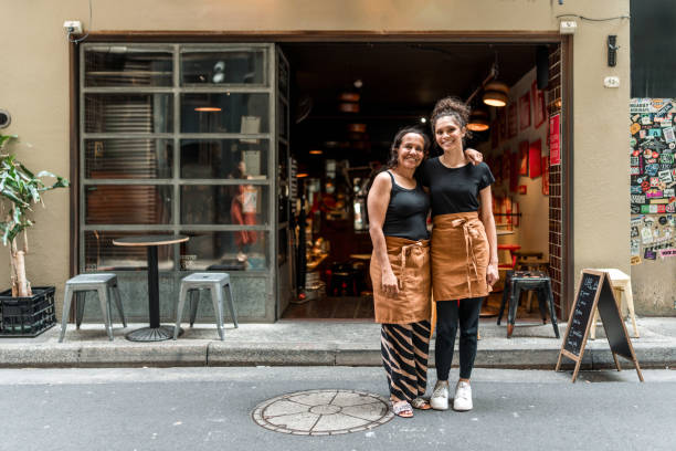 istock Friendly Aboriginal Waitresses Welcome Guests Outside Modern Sydney Cafe Setting 2191960655