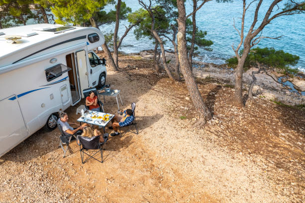istock Peaceful Seaside RV Camping Site With Outdoor Dining Under Trees 2191960730