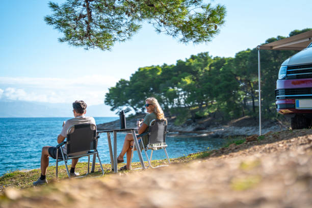 istock Peaceful Seaside Camping Scene With Couple Sharing Morning Coffee Break 2191960734