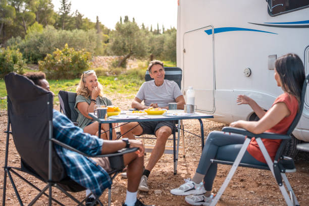 istock Diverse Friends Enjoy Casual Breakfast Outside Motor Home During Vacation 2191960821