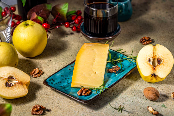 istock Wedge of cheese with quince and walnuts on serving platter 2191961407