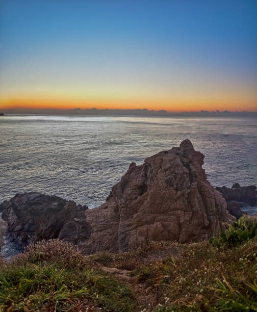 istock Rocky coastline emerging from the pacific ocean at dawn in oaxaca, mexico 2191970791