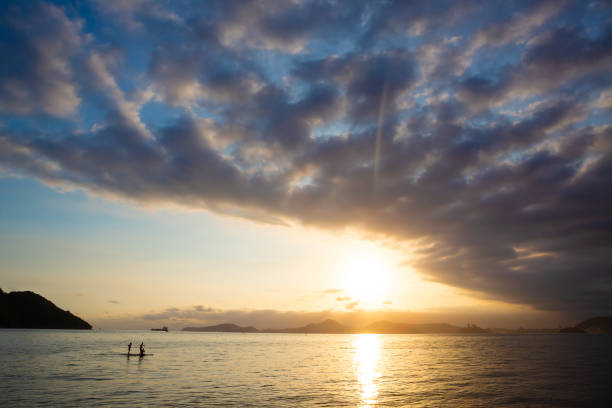 istock Late afternoon in Santos Bay with two stand up paddle boarders 2191974148