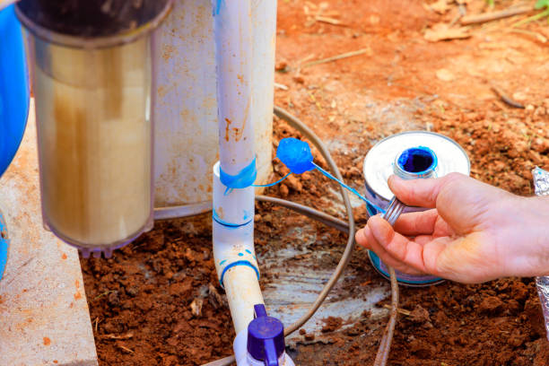 istock Water filtration system maintenance process taking place in a garden setting 2191974365
