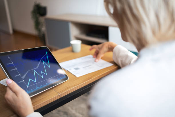 istock Businesswoman analyzing data on digital tablet with financial chart 2191978262