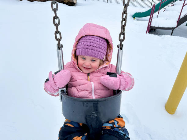 istock Baby playing in the snow 2191978406