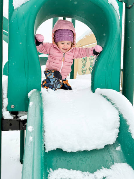 istock Baby playing in the snow 2191978408