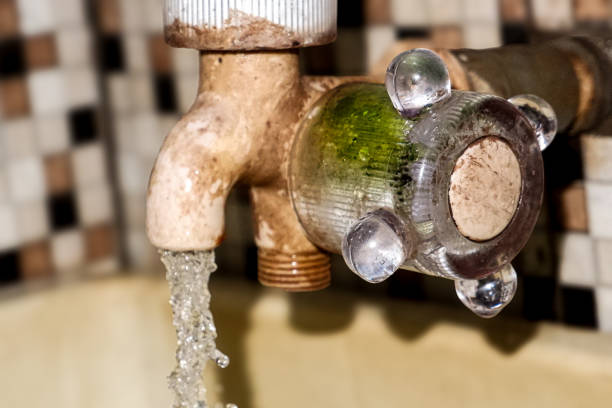 Water flowing from the water tap in the bathroom