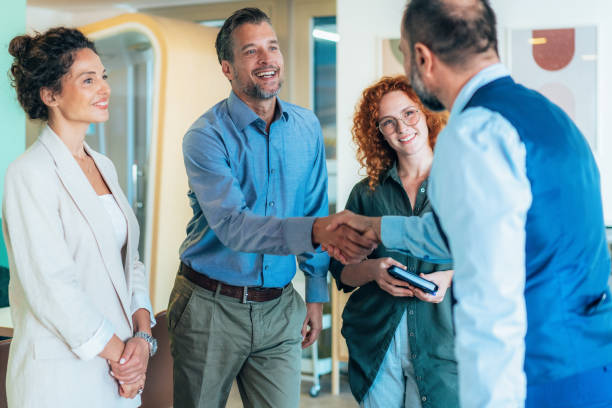 istock Business people shaking hands in the office 2191983065