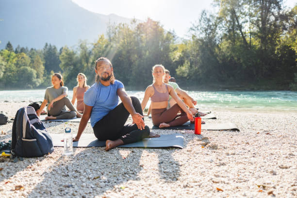 istock Group Yoga Session by the River 2191983435
