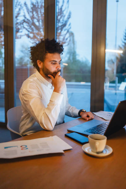 istock Focused Businessman Working Late Hours in Office 2191983497