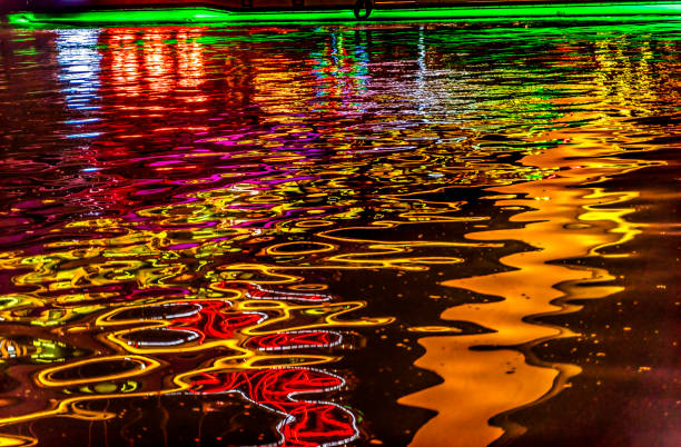Colorful Abstract Tourist Boat Night Illuminated Bridge Hai River Water Reflection Tianjin China. Hai River has beautiful lights at night creative colorful reflections.