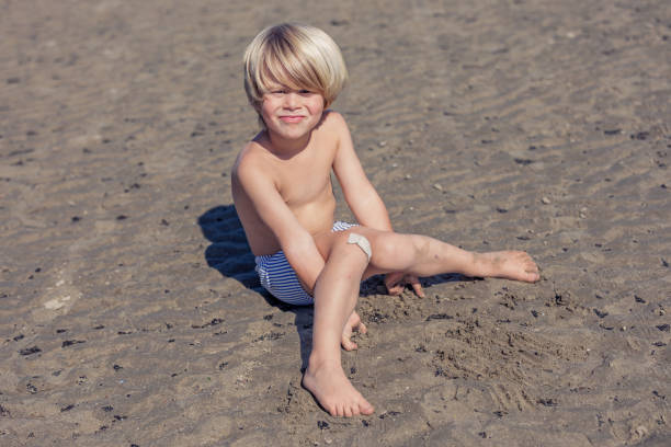 Smiling Child Enjoys a Sandy Beach Day in Sunshine in Knokke-Heist, Flanders, Belgium