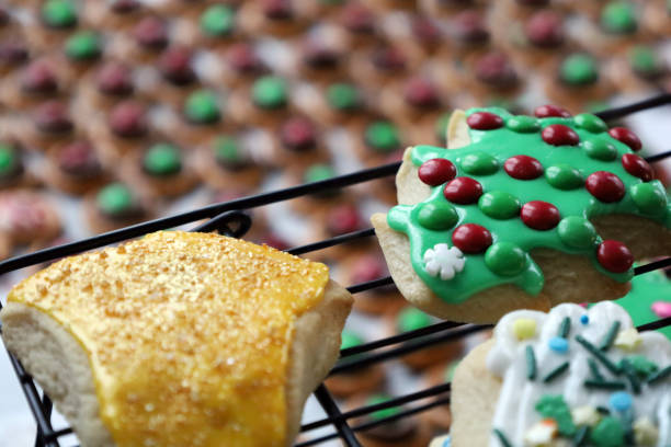 Gold and green frosted Christmas cookies with festive decorations